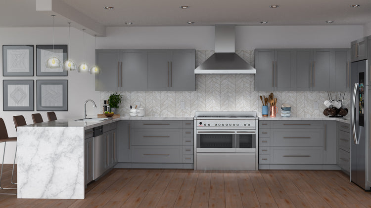 a kitchen with gray cabinets and stainless steel appliances