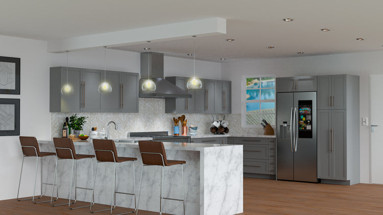 a kitchen with gray cabinets and a stainless steel refrigerator