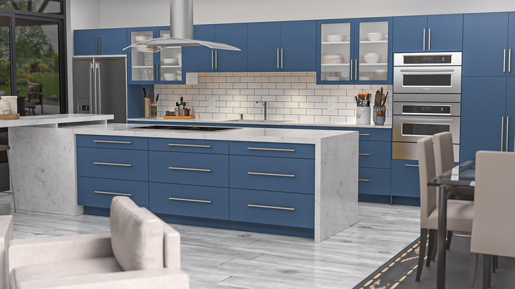 a kitchen with blue cabinets and white counter tops