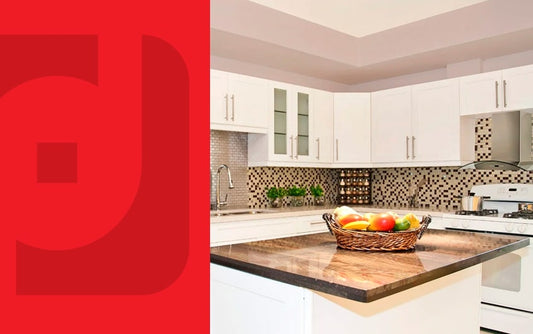 Kitchen with brown countertops, white shaker cabinets and a fruit basket