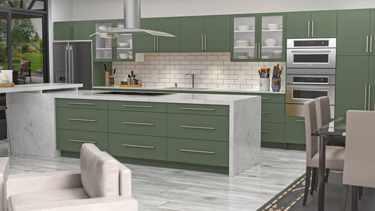 a kitchen with green cabinets and stainless steel appliances
