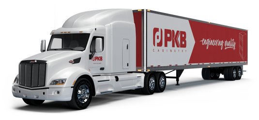 a white semi truck that says pkb cabinetry on the side